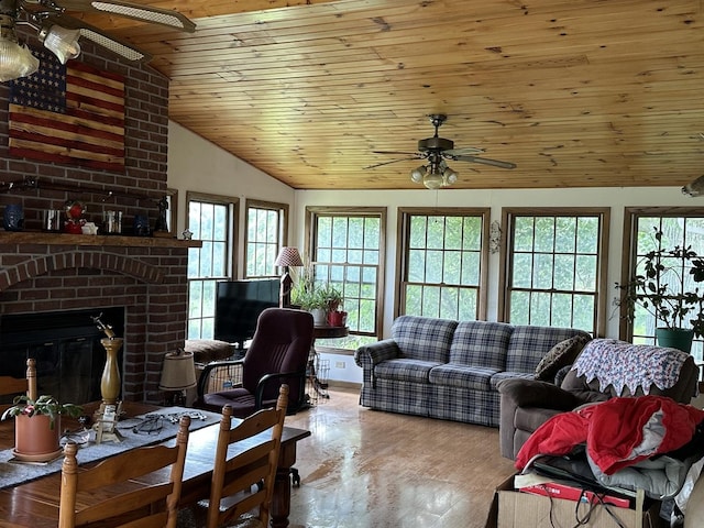 9669 Garden Plain Rd, Morrison, IL 61270 - living room with a ceiling fan, vaulted ceiling, wood ceiling, a fireplace, and wood finished floors