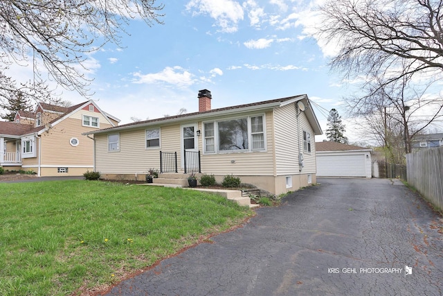 33219 N Sunset Ave, Grayslake, IL 60030 - view of front of home with a chimney, a detached garage, and an outdoor structure