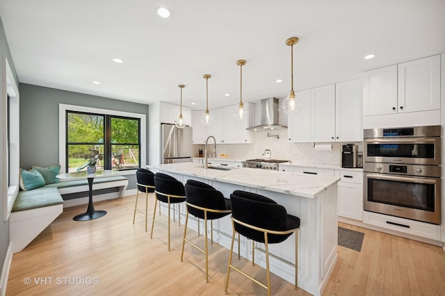 490 S Waukegan Rd, Lake Forest, IL 60045 - kitchen with wall chimney range hood, stainless steel appliances, a sink, recessed lighting, and tasteful backsplash