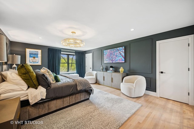 490 S Waukegan Rd, Lake Forest, IL 60045 - bedroom featuring light wood-type flooring, a chandelier, a decorative wall, and recessed lighting