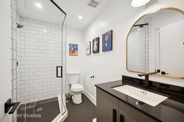490 S Waukegan Rd, Lake Forest, IL 60045 - bathroom with toilet, vanity, a stall shower, baseboards, and recessed lighting