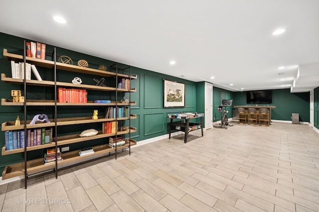 490 S Waukegan Rd, Lake Forest, IL 60045 - living area featuring bar, recessed lighting, a decorative wall, light wood-style flooring, and baseboards