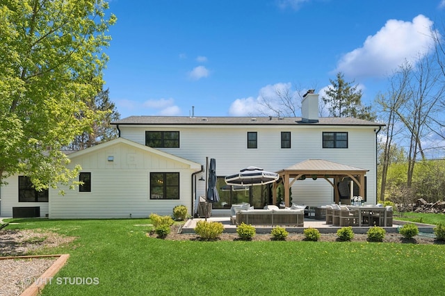 490 S Waukegan Rd, Lake Forest, IL 60045 - back of property with an outdoor living space, a gazebo, a patio, a chimney, and a lawn
