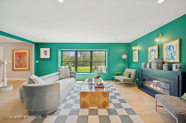 490 S Waukegan Rd, Lake Forest, IL 60045 - living room with recessed lighting, a glass covered fireplace, wood finished floors, and baseboards