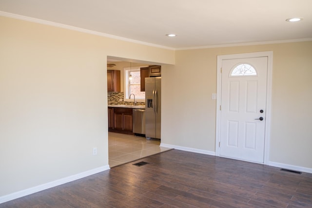 2702 N 76th Ave, Elmwood Park, IL 60707 - entrance foyer featuring ornamental molding, light wood-style flooring, recessed lighting, and baseboards