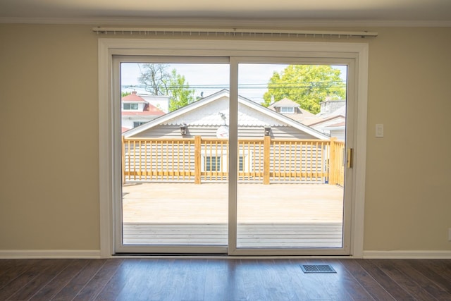 2702 N 76th Ave, Elmwood Park, IL 60707 - doorway to outside with healthy amount of natural light, ornamental molding, wood finished floors, and baseboards