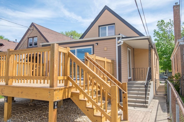 2702 N 76th Ave, Elmwood Park, IL 60707 - rear view of property featuring a wooden deck, a gate, and stairs
