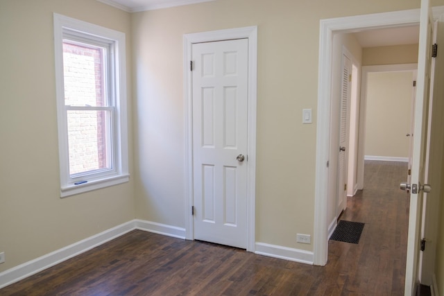 2702 N 76th Ave, Elmwood Park, IL 60707 - unfurnished bedroom featuring dark wood-style floors and baseboards