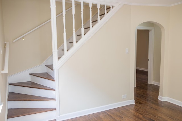 2702 N 76th Ave, Elmwood Park, IL 60707 - stairway featuring arched walkways, wood finished floors, baseboards, and ornamental molding