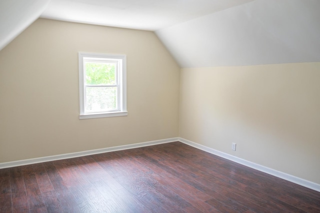 2702 N 76th Ave, Elmwood Park, IL 60707 - additional living space featuring dark wood-type flooring, lofted ceiling, and baseboards