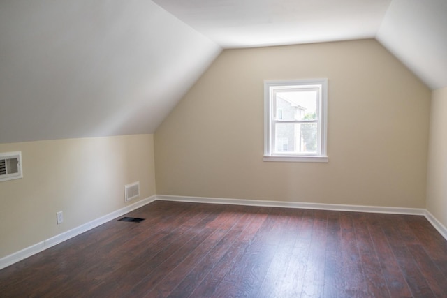 2702 N 76th Ave, Elmwood Park, IL 60707 - additional living space with dark wood-type flooring, baseboards, and lofted ceiling