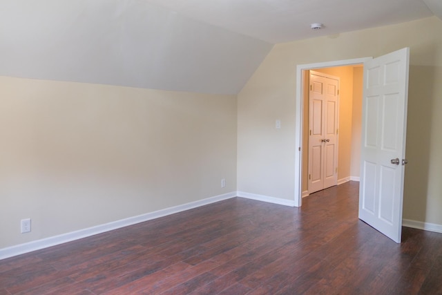2702 N 76th Ave, Elmwood Park, IL 60707 - additional living space with dark wood finished floors, lofted ceiling, and baseboards
