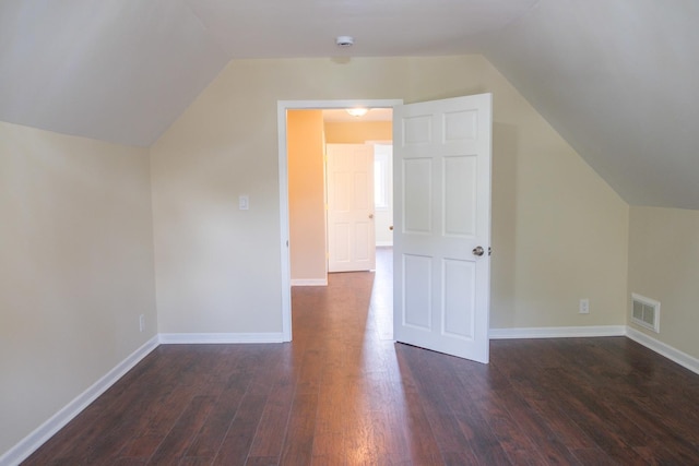 2702 N 76th Ave, Elmwood Park, IL 60707 - bonus room with lofted ceiling, dark wood-style floors, and baseboards