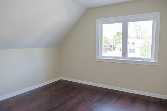 2702 N 76th Ave, Elmwood Park, IL 60707 - bonus room with dark wood-type flooring, vaulted ceiling, and baseboards