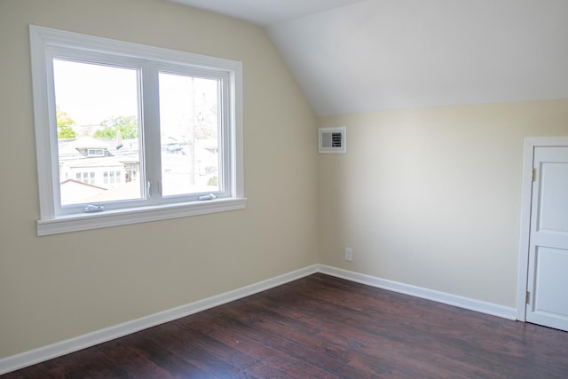 2702 N 76th Ave, Elmwood Park, IL 60707 - bonus room with plenty of natural light, dark wood-style floors, lofted ceiling, and baseboards