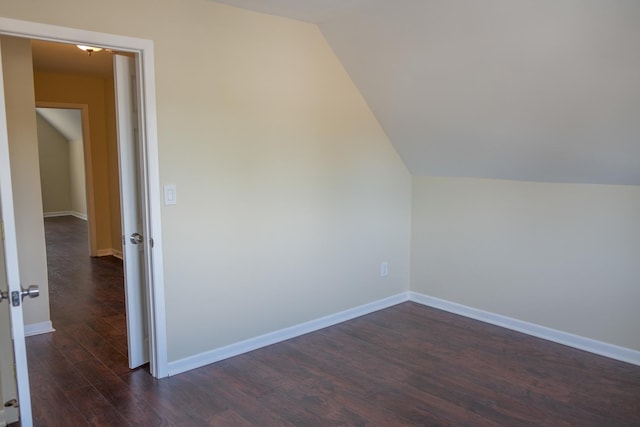2702 N 76th Ave, Elmwood Park, IL 60707 - bonus room featuring vaulted ceiling, dark wood finished floors, and baseboards