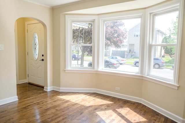 2702 N 76th Ave, Elmwood Park, IL 60707 - entryway with healthy amount of natural light, arched walkways, wood finished floors, baseboards, and ornamental molding
