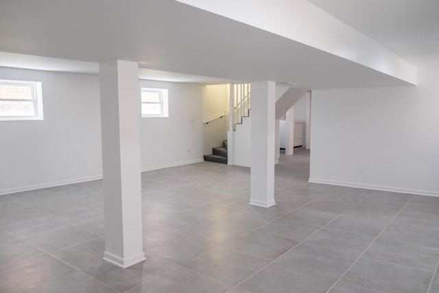 2702 N 76th Ave, Elmwood Park, IL 60707 - basement with stairs, plenty of natural light, tile patterned flooring, and baseboards