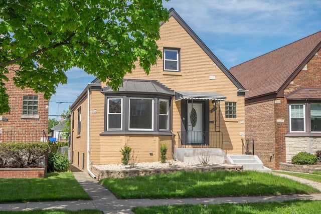 2702 N 76th Ave, Elmwood Park, IL 60707 - view of front of house with brick siding and a standing seam roof