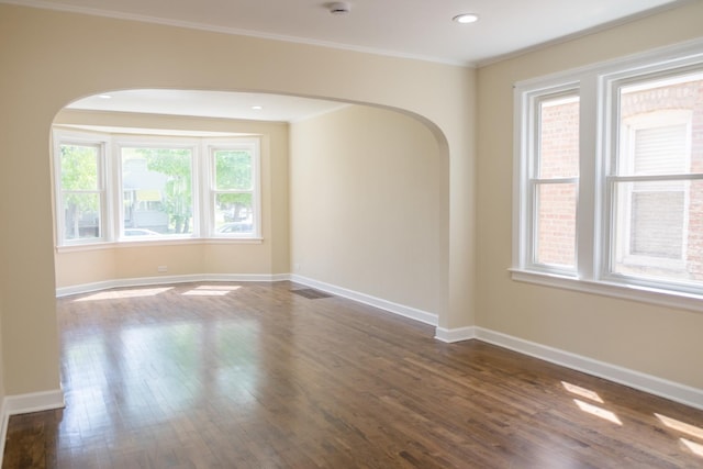 2702 N 76th Ave, Elmwood Park, IL 60707 - spare room with arched walkways, dark wood-style floors, baseboards, ornamental molding, and recessed lighting