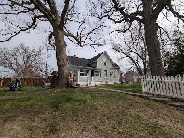 1215 3rd St, Moline, IL 61265 - back of house featuring a sunroom and a chimney