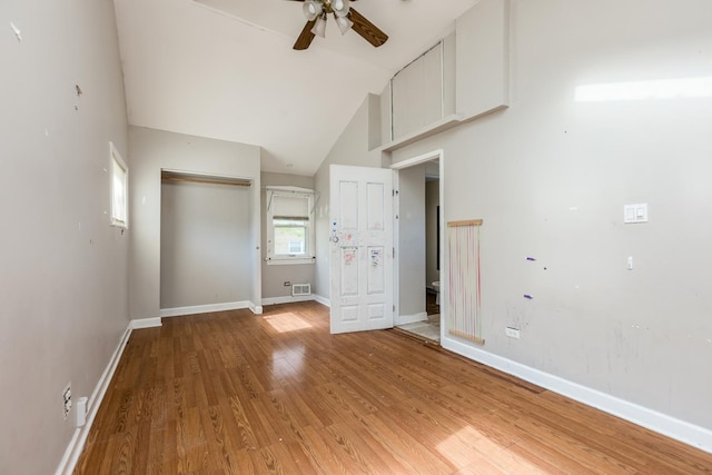 3924 W Greenleaf Ave, Lincolnwood, IL 60712 - unfurnished bedroom featuring light wood-style floors, baseboards, a closet, lofted ceiling, and ceiling fan