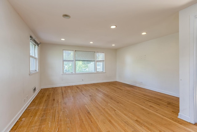 3924 W Greenleaf Ave, Lincolnwood, IL 60712 - spare room with light wood finished floors, baseboards, and recessed lighting