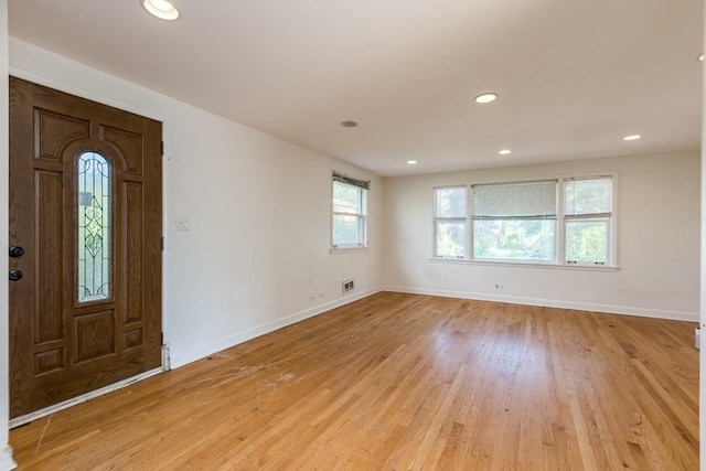 3924 W Greenleaf Ave, Lincolnwood, IL 60712 - entryway featuring baseboards, light wood-type flooring, and recessed lighting