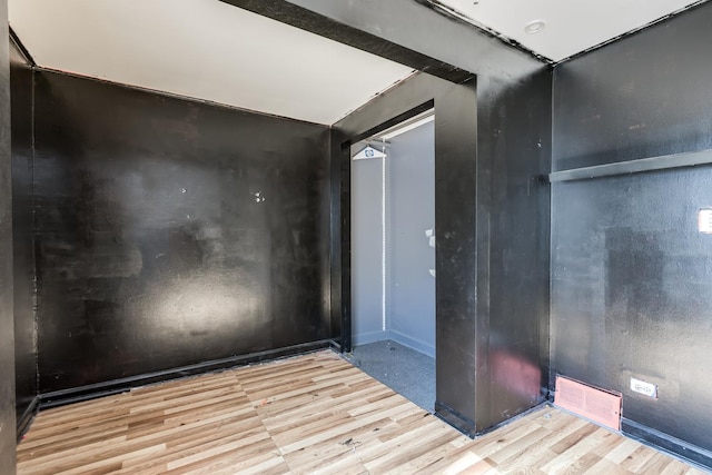 3924 W Greenleaf Ave, Lincolnwood, IL 60712 - unfurnished room with wood finished floors and baseboards