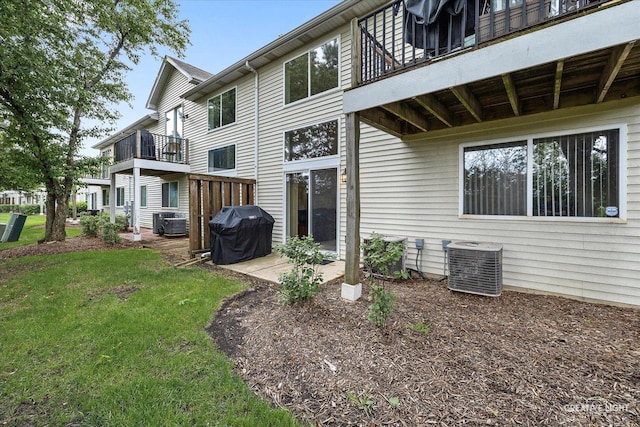937 Huntington Dr, Elk Grove Village, IL 60007 - rear view of house with a balcony, central air condition unit, a yard, and a patio