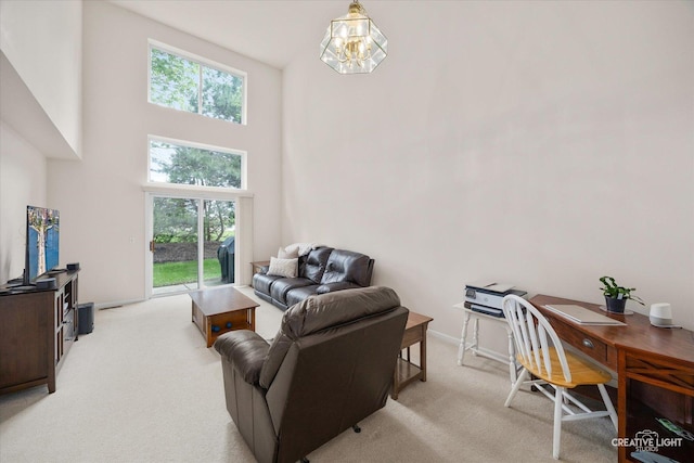 937 Huntington Dr, Elk Grove Village, IL 60007 - living area featuring a high ceiling, light colored carpet, healthy amount of natural light, and an office area