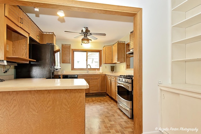 5704 N Woodland Dr, Mchenry, IL 60050 - kitchen featuring black appliances, a sink, ceiling fan, a peninsula, and brick patterned floors