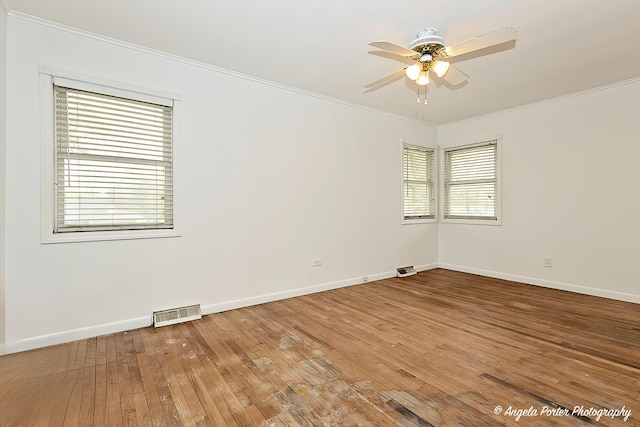 5704 N Woodland Dr, Mchenry, IL 60050 - unfurnished room with crown molding, ceiling fan, baseboards, and light wood-style flooring