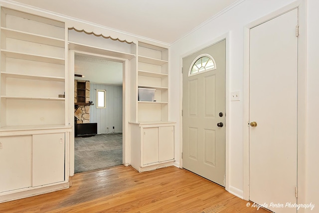 5704 N Woodland Dr, Mchenry, IL 60050 - foyer featuring light wood-style floors and ornamental molding