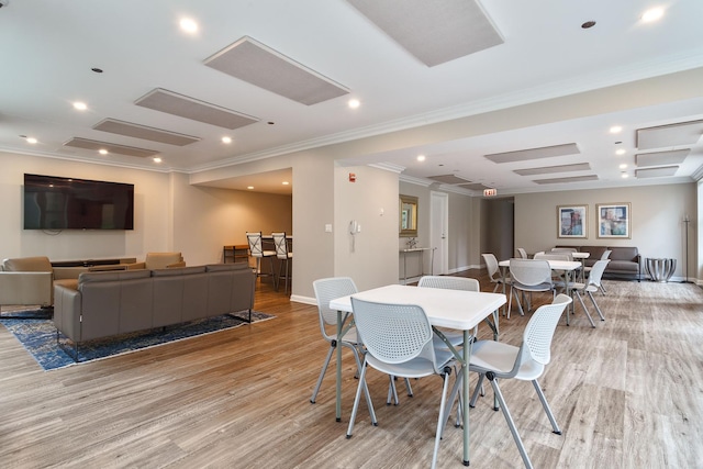25 E Superior St Unit 2805, Chicago, IL 60611 - dining space with light wood finished floors, crown molding, baseboards, and recessed lighting