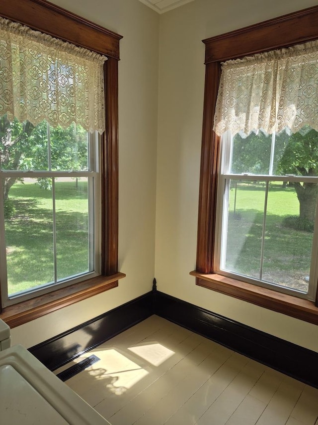 123 W Maple St, Franklin Grove, IL 61031 - spare room featuring healthy amount of natural light and crown molding