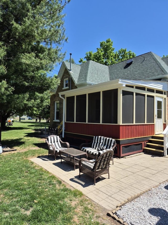 123 W Maple St, Franklin Grove, IL 61031 - rear view of property with a patio area, a sunroom, a shingled roof, and a lawn