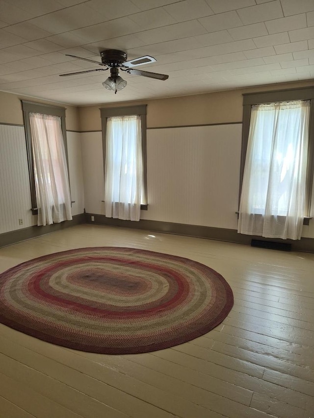 123 W Maple St, Franklin Grove, IL 61031 - empty room featuring ceiling fan and baseboards
