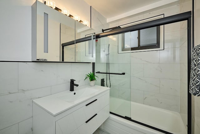 6300 N Sheridan Rd Unit 112, Chicago, IL 60660 - bathroom with vanity, shower / bath combination with glass door, and tile walls