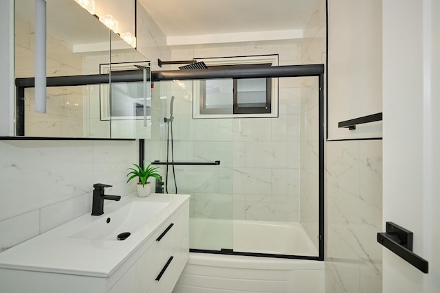 6300 N Sheridan Rd Unit 112, Chicago, IL 60660 - bathroom featuring vanity, enclosed tub / shower combo, and tile walls