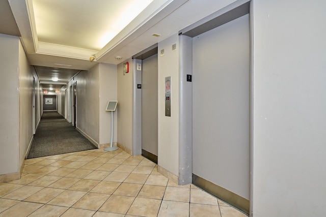6300 N Sheridan Rd Unit 112, Chicago, IL 60660 - corridor with elevator, light tile patterned floors, and baseboards