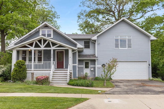 506 Carleton Ave, Glen Ellyn, IL 60137 - view of front of house featuring covered porch, a garage, and driveway