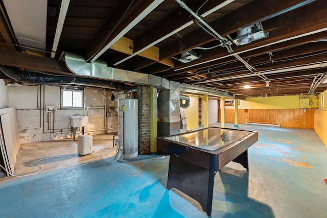 506 Carleton Ave, Glen Ellyn, IL 60137 - basement with gas water heater, a sink, and wood walls