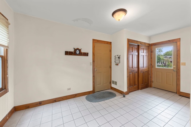 506 Carleton Ave, Glen Ellyn, IL 60137 - entrance foyer featuring baseboards, plenty of natural light, and light tile patterned floors
