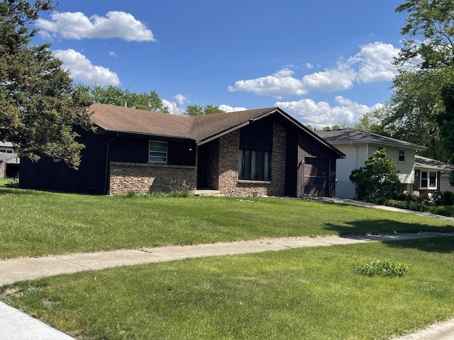 1410 Brentwood Pl, Joliet, IL 60435 - view of front of home with an attached garage, a front lawn, and brick siding