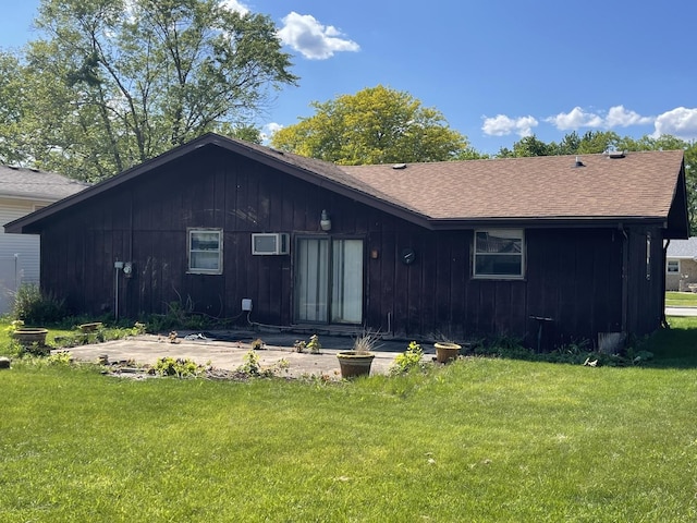 1410 Brentwood Pl, Joliet, IL 60435 - rear view of house with a shingled roof, a lawn, and board and batten siding