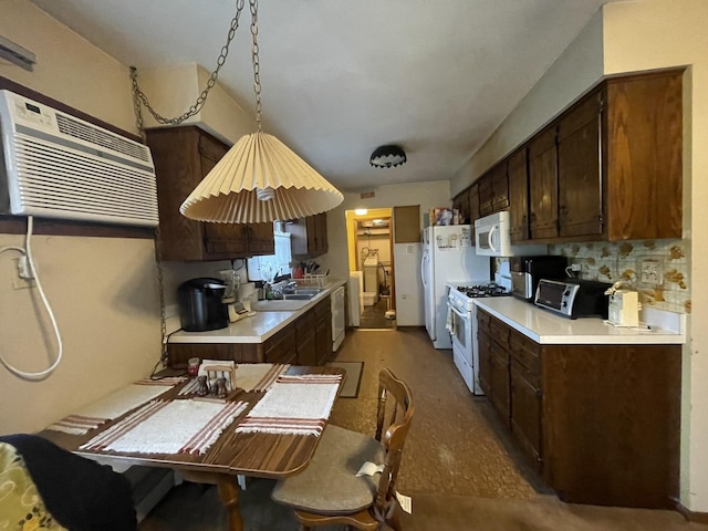 1410 Brentwood Pl, Joliet, IL 60435 - kitchen with white appliances, light countertops, dark brown cabinets, and a sink