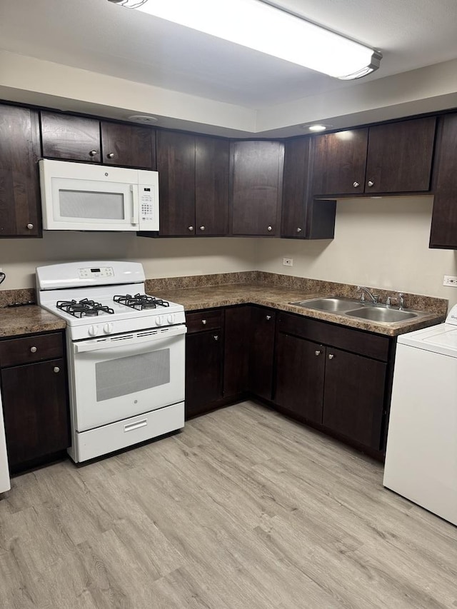 3936 169th St, Country Club Hills, IL 60478 - kitchen featuring white appliances, washer / clothes dryer, a sink, dark brown cabinets, and light wood-style floors