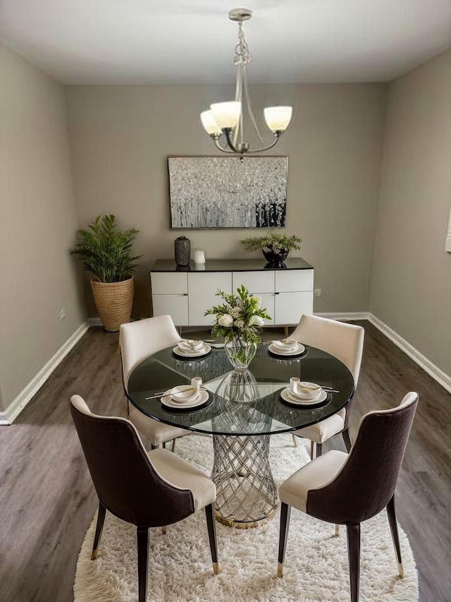 3936 169th St, Country Club Hills, IL 60478 - dining space with a chandelier, baseboards, and dark wood finished floors