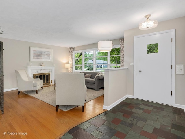 407 Turner Ave, Glen Ellyn, IL 60137 - entrance foyer with a high end fireplace, baseboards, and wood finished floors